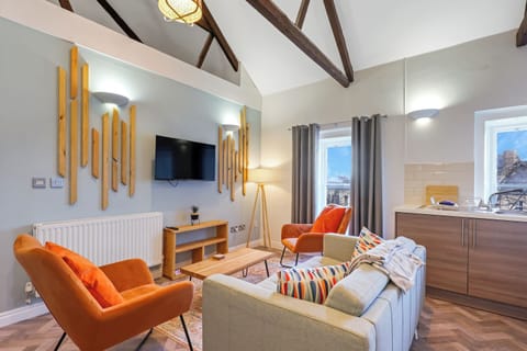 Apartment, City View | Living area | 30-inch TV with cable channels