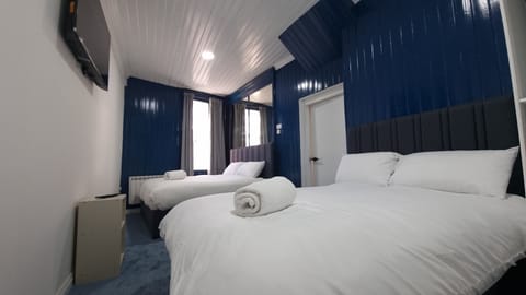 Family Room | Select Comfort beds, iron/ironing board, free WiFi, bed sheets