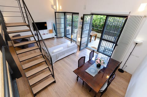 Apartment, Courtyard View | Living area | 50-inch Smart TV with cable channels