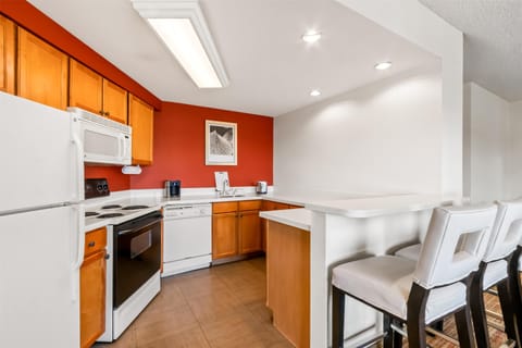 Suite, Multiple Beds | Private kitchen | Fridge, microwave, stovetop, dishwasher
