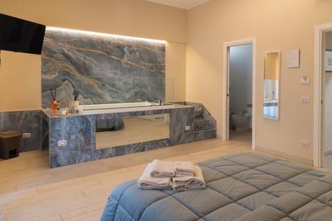 Deluxe Room, Balcony, Courtyard View | Blackout drapes, iron/ironing board, free WiFi