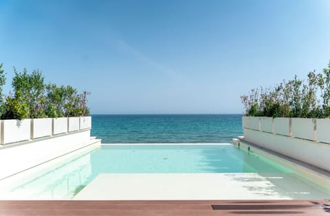 Outdoor pool, open 10:00 AM to 5:00 PM, pool umbrellas, sun loungers