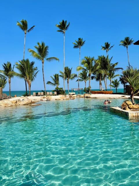 On the beach, white sand, sun loungers, beach umbrellas
