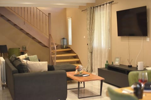 Family House, Garden View | Living area | Flat-screen TV