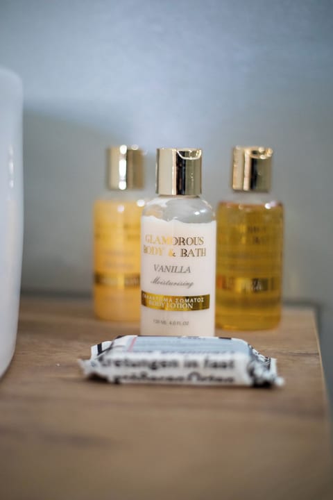 Shower, hair dryer, slippers, towels