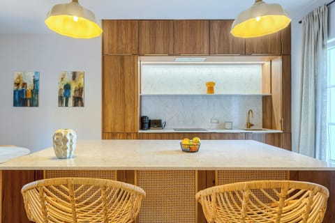 Deluxe Apartment, Pool View | Private kitchen | Coffee/tea maker, electric kettle