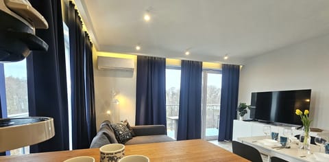 Comfort Apartment, Balcony, Beach View | Living area | 50-inch LCD TV with cable channels