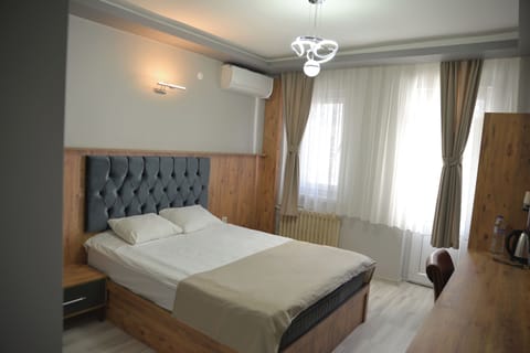 Deluxe Single Room, Balcony, City View | Desk, laptop workspace, iron/ironing board, free WiFi