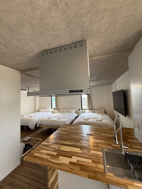 Comfort Triple Room, Non Smoking, Kitchen | Blackout drapes, WiFi (free), bed sheets