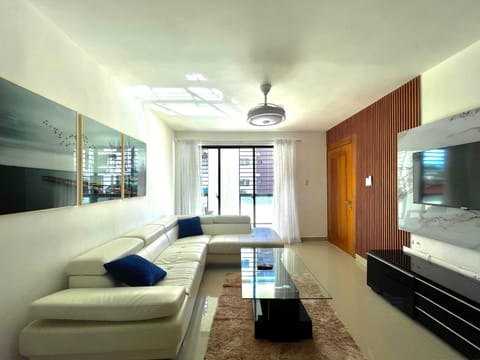 Luxury Suite | Living area | 42-inch Smart TV with cable channels