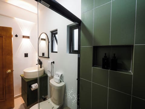 Standard Suite | Bathroom | Shower, rainfall showerhead, hair dryer, slippers