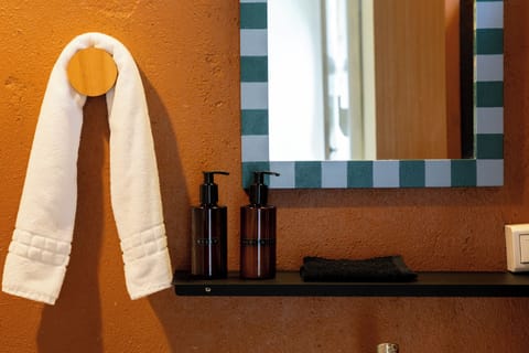 Deluxe Double Room, Patio | Bathroom | Shower, free toiletries, hair dryer, towels