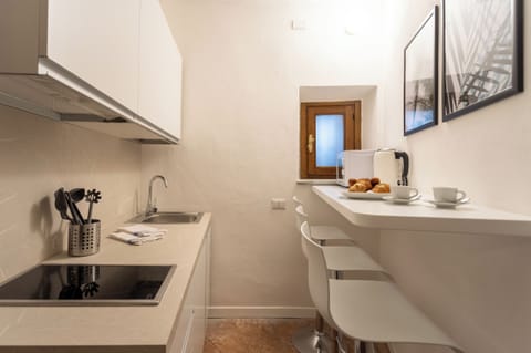 Apartment (1 Bedroom) | Private kitchen | Microwave, espresso maker, electric kettle, highchair