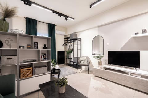 Luxury Studio Suite, Balcony | Living area | 42-inch TV with cable channels