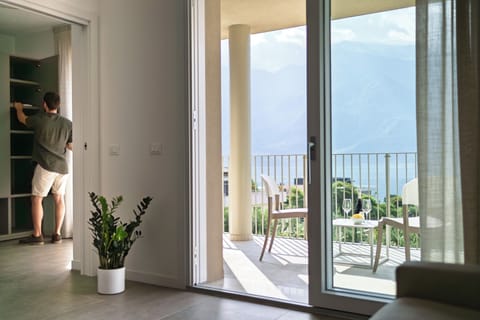 Panoramic Apartment, Balcony, Lake View | Living area | 50-inch LED TV with digital channels