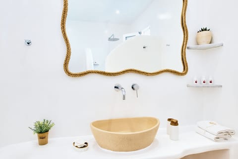 Luxury Triple Room, Sea View | Bathroom | Shower, hair dryer, slippers, towels