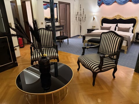 Deluxe Suite, Private Bathroom, City View | Living area | TV