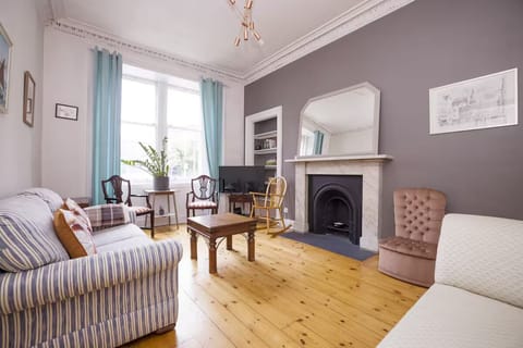 Family Apartment, City View | Living area | 24-inch flat-screen TV with cable channels
