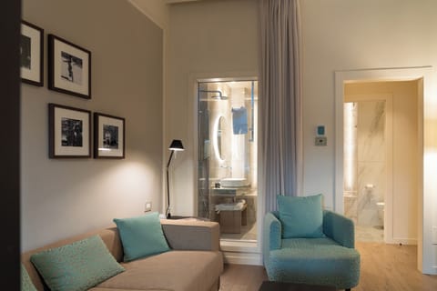 Suite, River View | Living area | 50-inch TV with digital channels