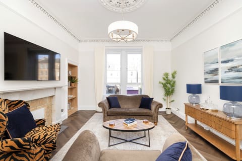 Standard Apartment | Living area | 24-inch flat-screen TV with cable channels, TV