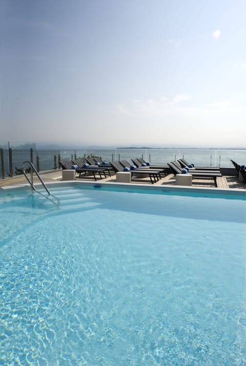 Outdoor pool, pool umbrellas, sun loungers