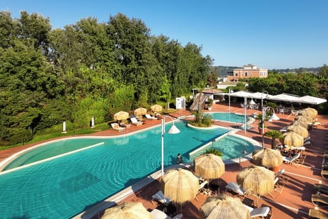 Seasonal outdoor pool, open 10:00 AM to 6:00 PM, pool umbrellas