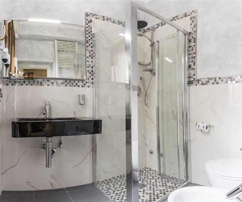 Superior Quadruple Room, Balcony | Bathroom | Shower, hair dryer, towels, toilet paper