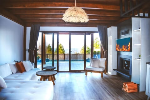 Bungalow, Lake View | Living area | Flat-screen TV