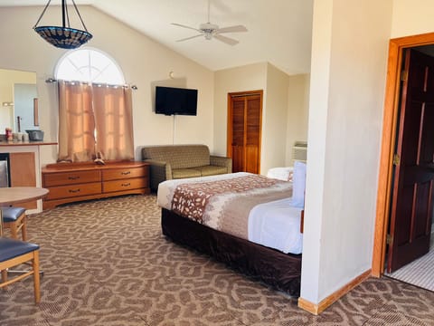 Suite, 2 Queen Beds, Non Smoking | Desk, iron/ironing board (on request), WiFi (free), bed sheets