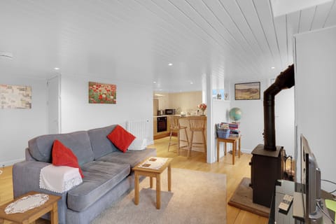 Cottage | Living area | 30-inch TV with satellite channels