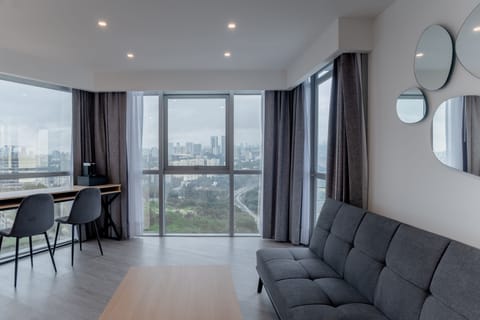 Premium Room, City View | Living area | 50-inch Smart TV with cable channels