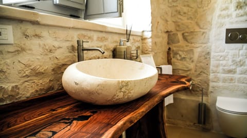 Shower, hair dryer, slippers, towels