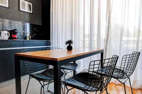 Comfort Studio, Balcony, City View | Living area | 50-inch Smart TV with digital channels