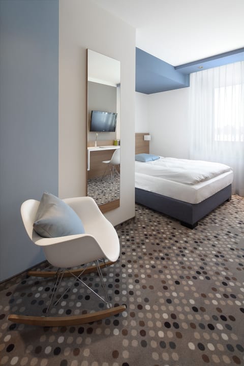 Premium bedding, down comforters, in-room safe, desk