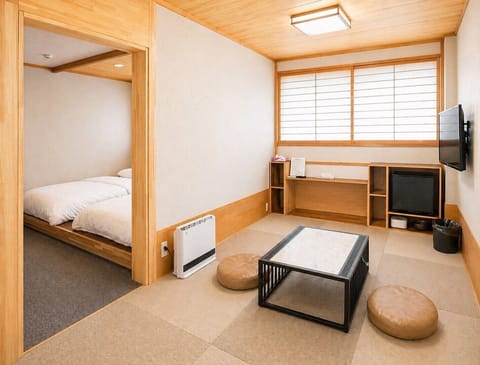 Luxury Twin Room, Slope side | Living area | TV, heated floors