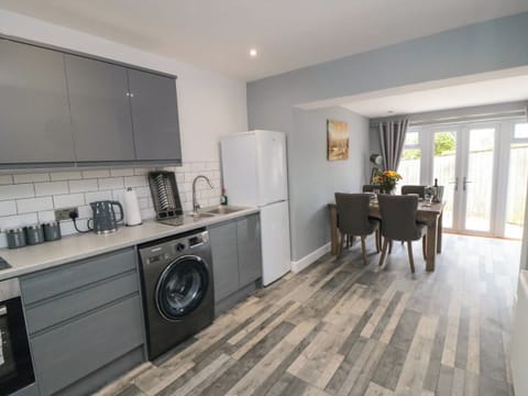 Fridge, electric kettle, cookware/dishes/utensils