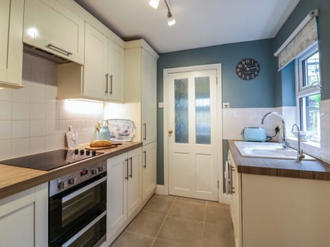 Fridge, electric kettle, toaster, cookware/dishes/utensils