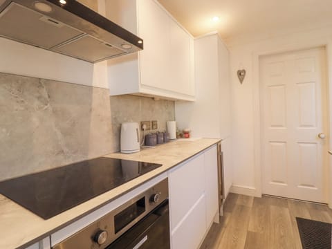 Fridge, electric kettle, cookware/dishes/utensils