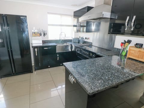 Fridge, dishwasher, electric kettle, cookware/dishes/utensils