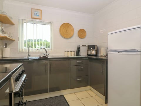 Fridge, electric kettle, toaster, cookware/dishes/utensils