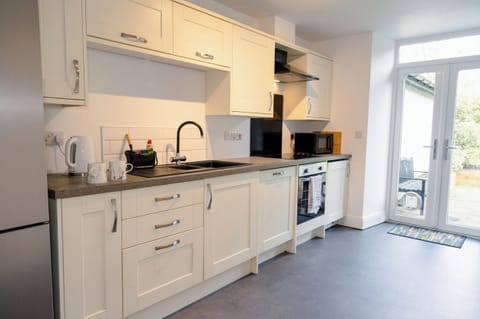 Fridge, dishwasher, electric kettle, cookware/dishes/utensils