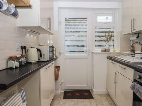 Fridge, electric kettle, toaster, cookware/dishes/utensils