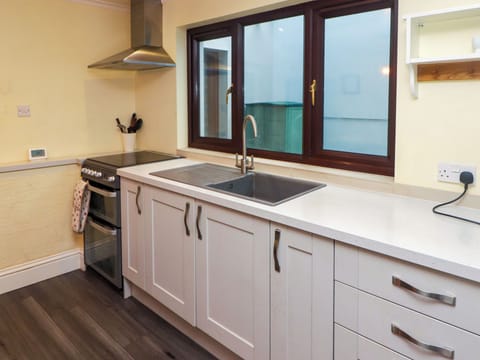 Fridge, electric kettle, toaster, cookware/dishes/utensils