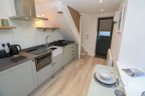 Fridge, electric kettle, toaster, cookware/dishes/utensils