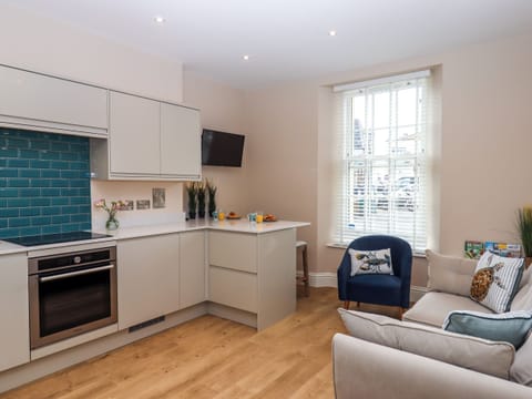 Fridge, electric kettle, cookware/dishes/utensils