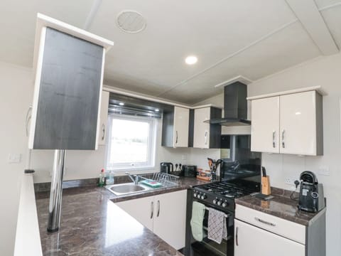 Fridge, electric kettle, cookware/dishes/utensils