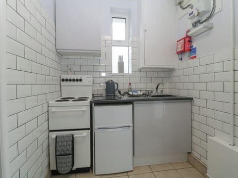 Fridge, electric kettle, toaster, cookware/dishes/utensils