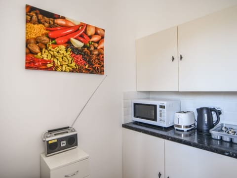 Fridge, electric kettle, toaster, cookware/dishes/utensils