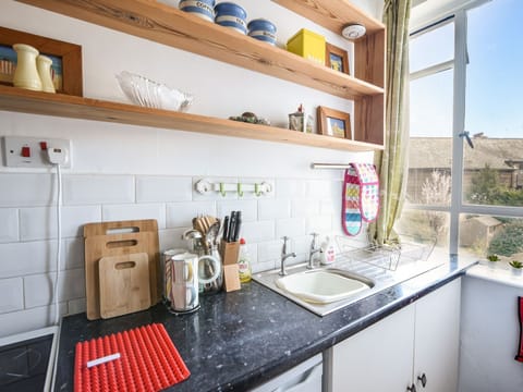 Fridge, electric kettle, toaster, cookware/dishes/utensils