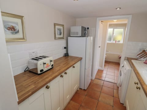 Fridge, electric kettle, toaster, cookware/dishes/utensils